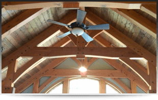 A view of a ceiling of the house with a ceiling fan