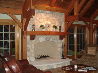 A luxurious living room with a fireplace in the middle