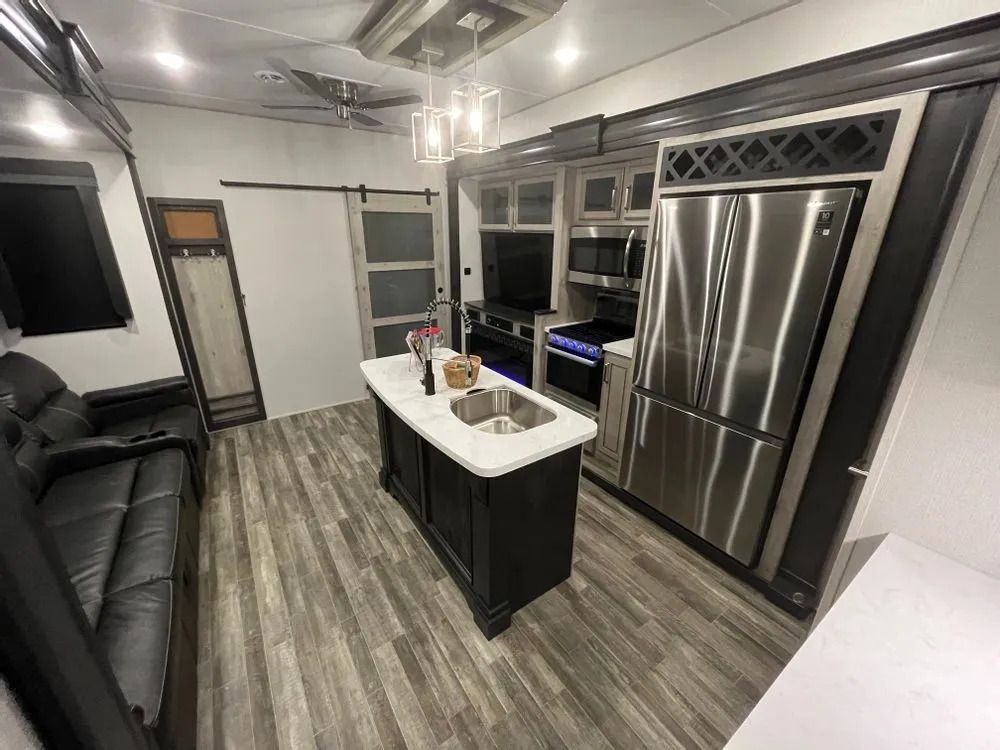 Interior of an RV kitchen and living area