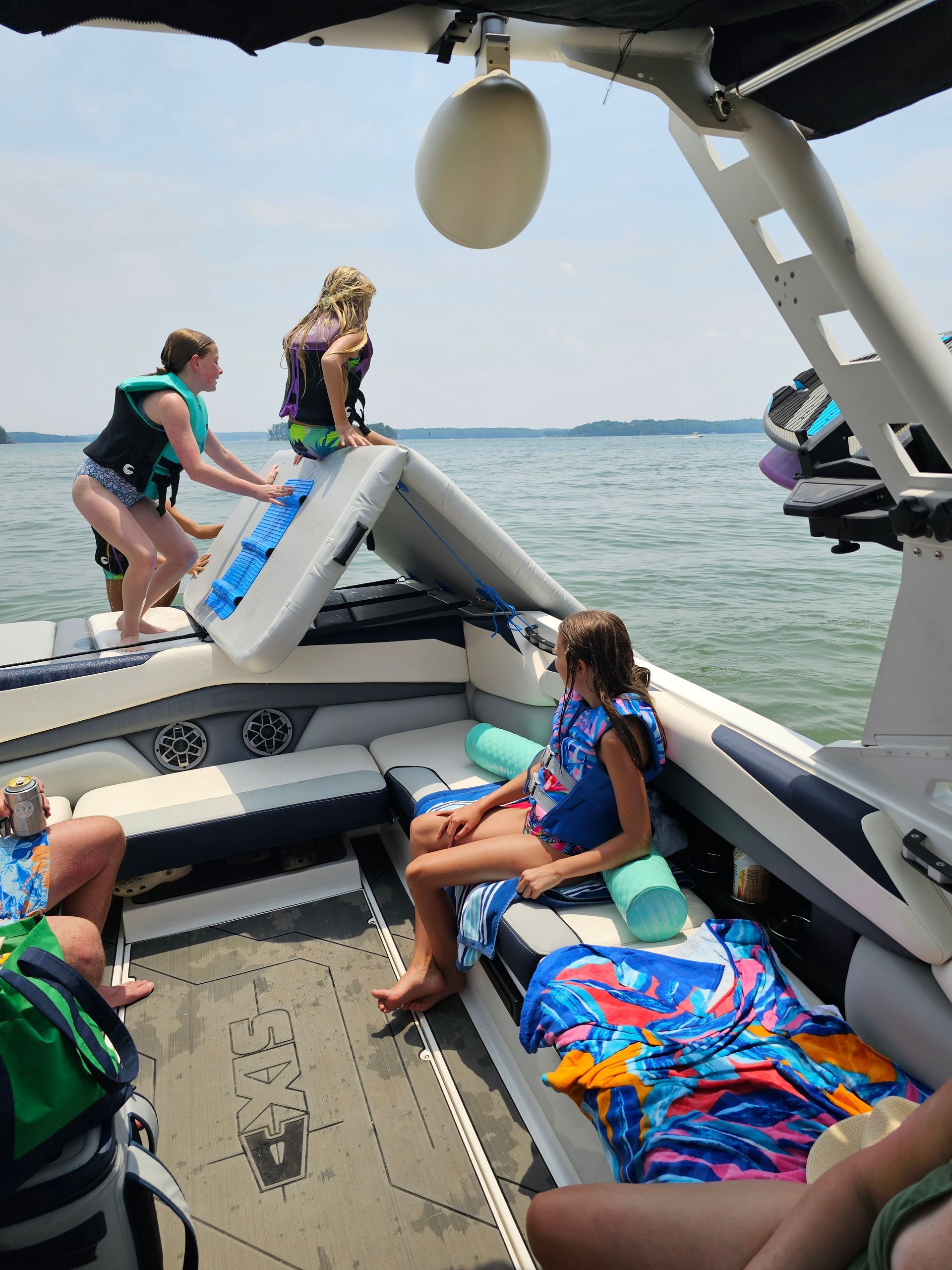 A group of people are on a boat in the water