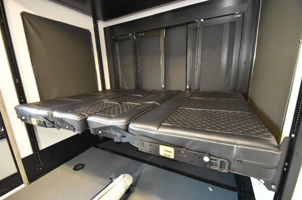 A bed is sitting in the back of a trailer