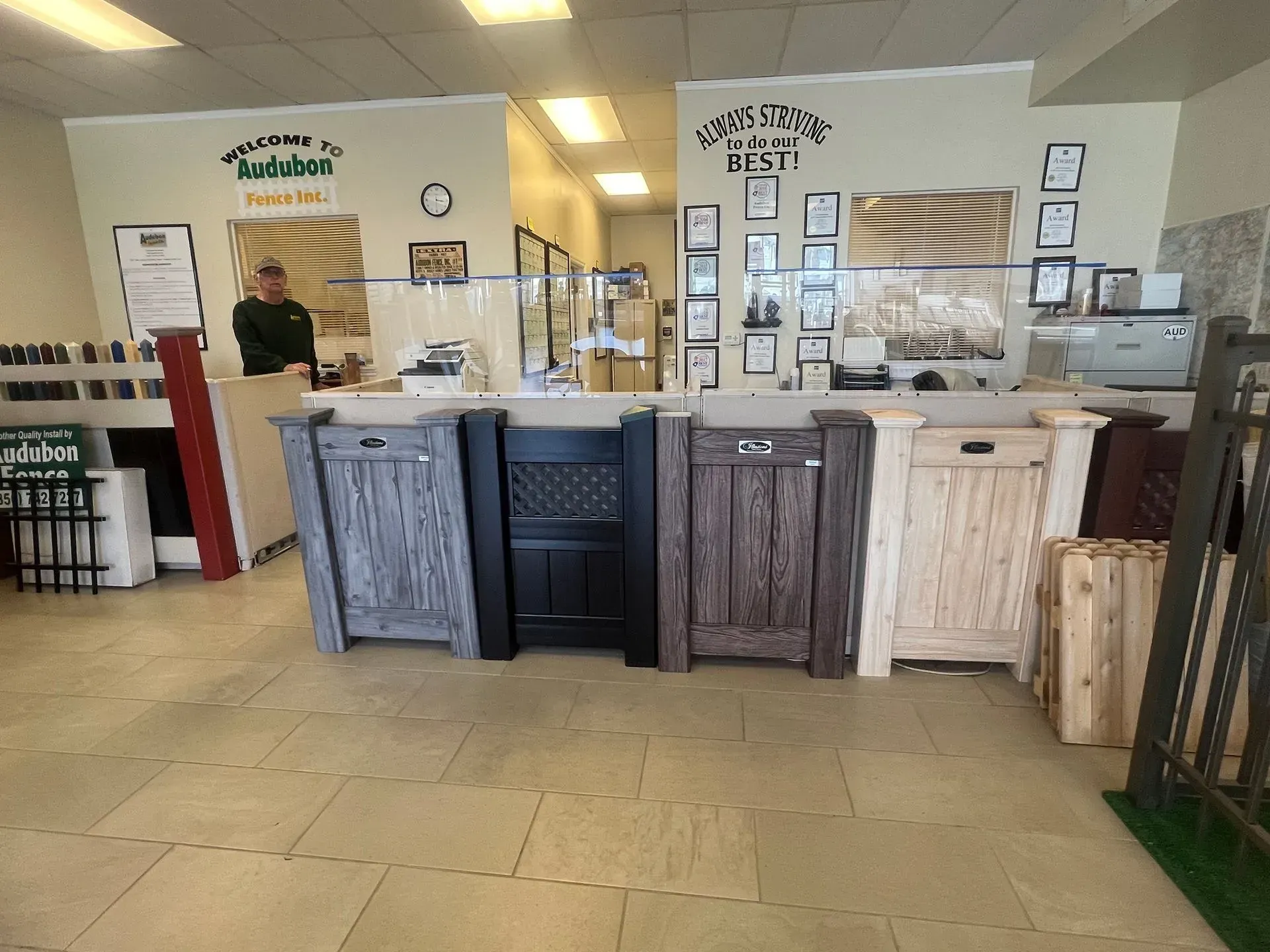 Coffee shop counter with rustic wood panels, pastry display cases, and tiled floor interior