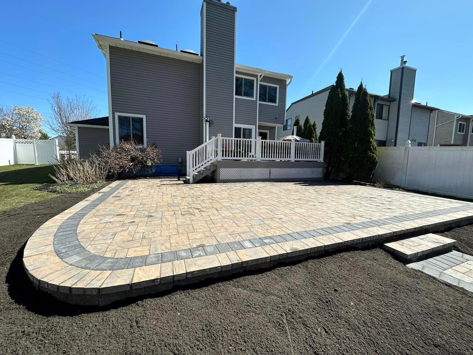A large house with a patio in front of it