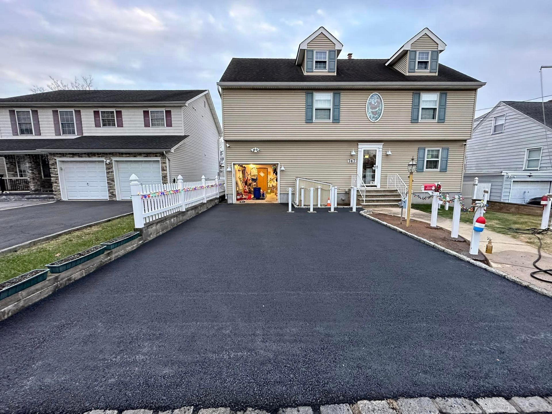 A large house with a large driveway leading to it.