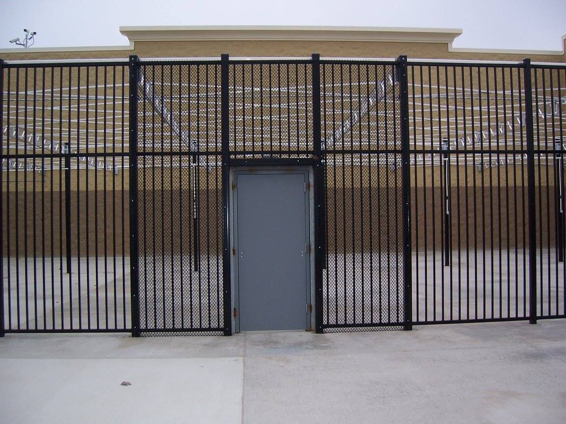 A building with a fence around it and a door