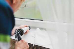 Man Repairing Window