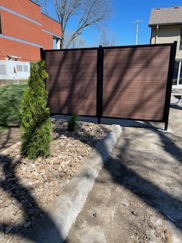 A wooden vinyl fence