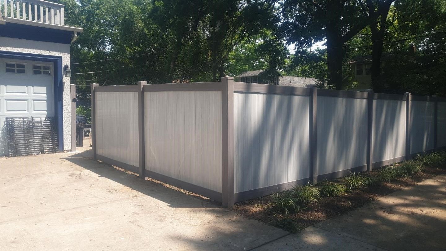 Gray corner vinyl fence