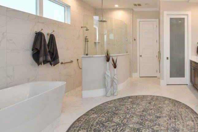 Frameless shower enclosure