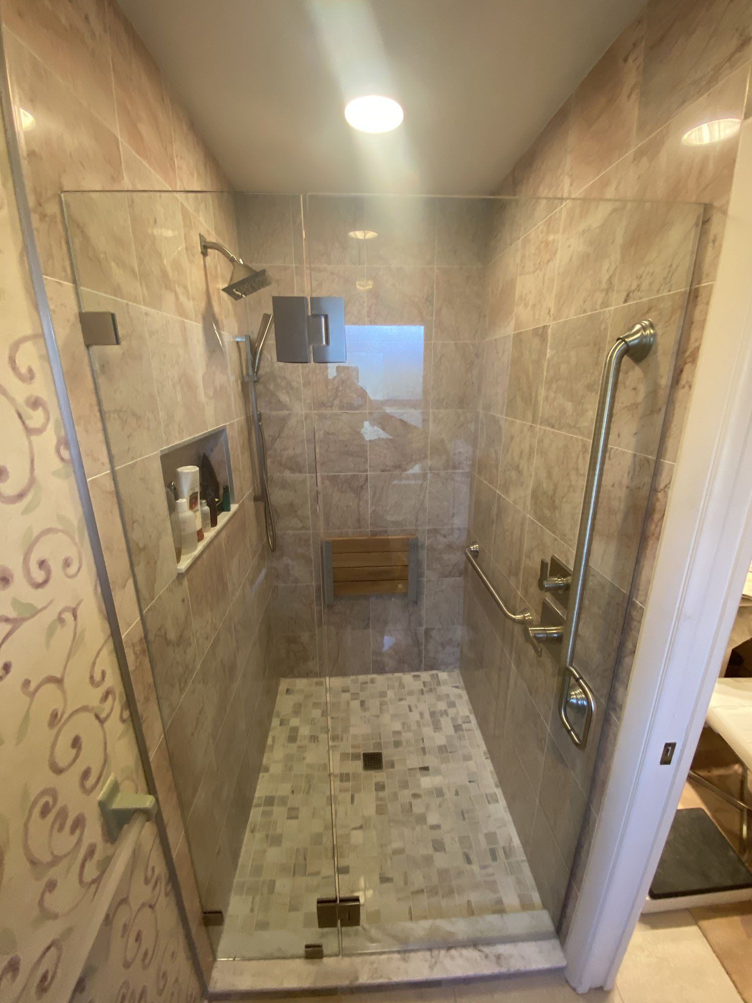 Frameless shower enclosure
