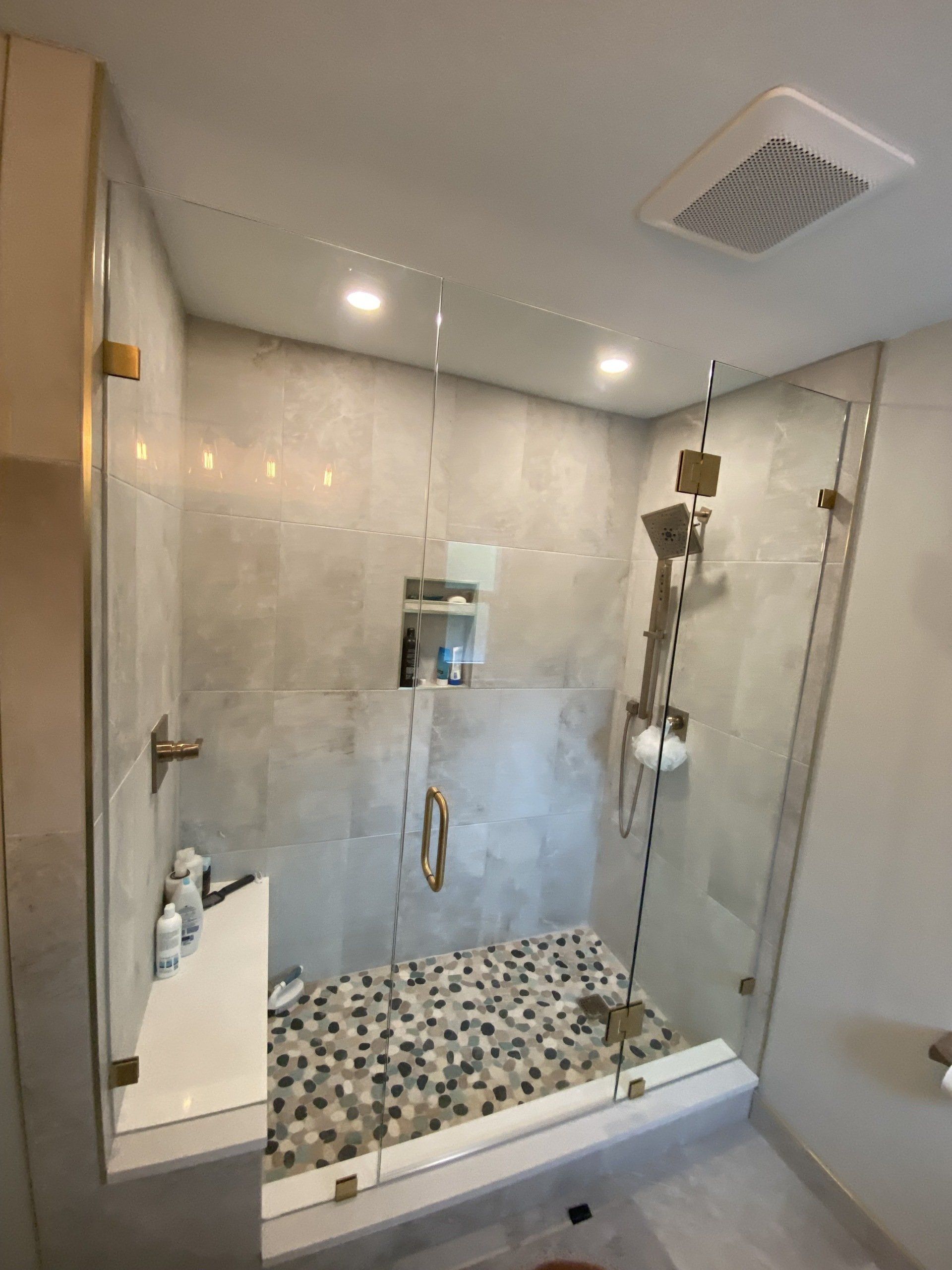 Frameless shower enclosure