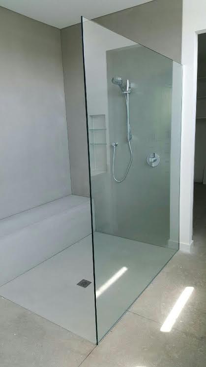 Frameless shower enclosure