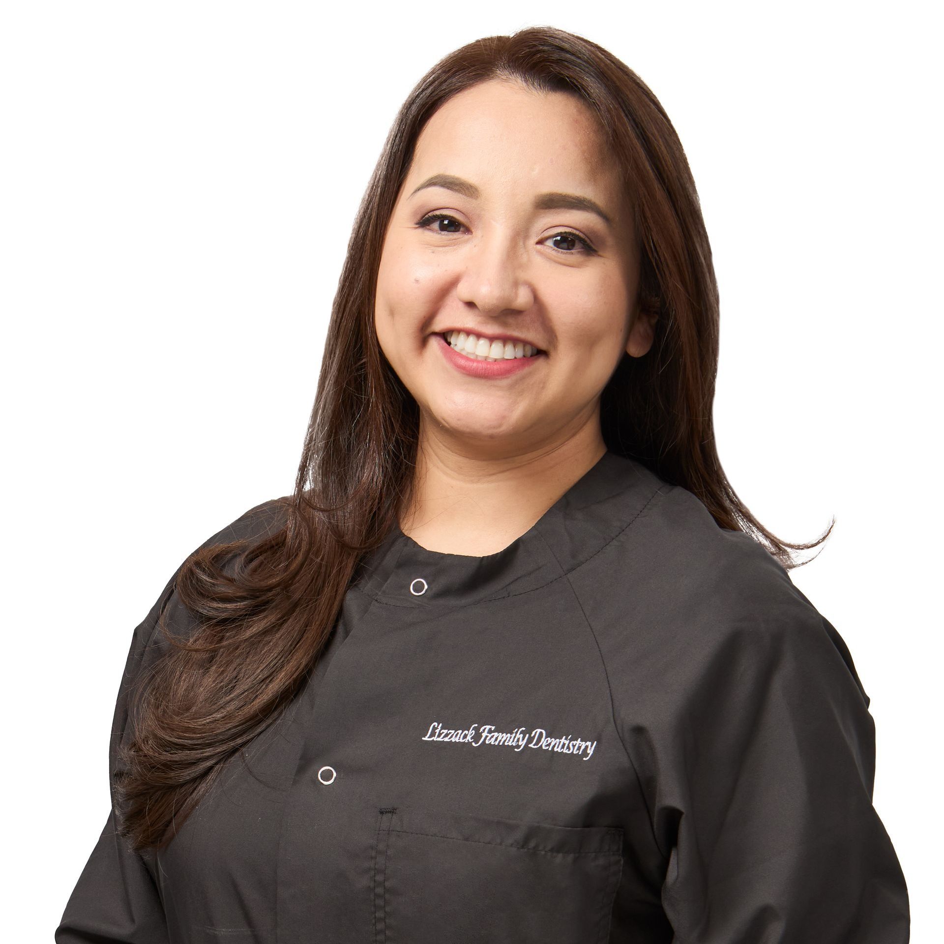 Woman with brown hair smiles at the camera while wearing a black work shirt. Her name tag reads