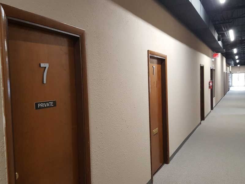 A long hallway with the number 7 on the door
