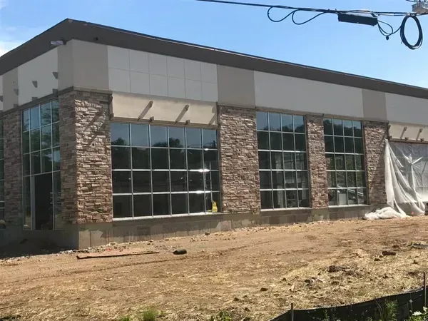 A large building with a lot of windows is being built