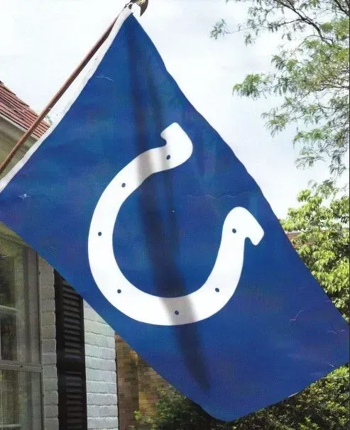 Indianapolis Colts flag with a white horseshoe on a blue background.