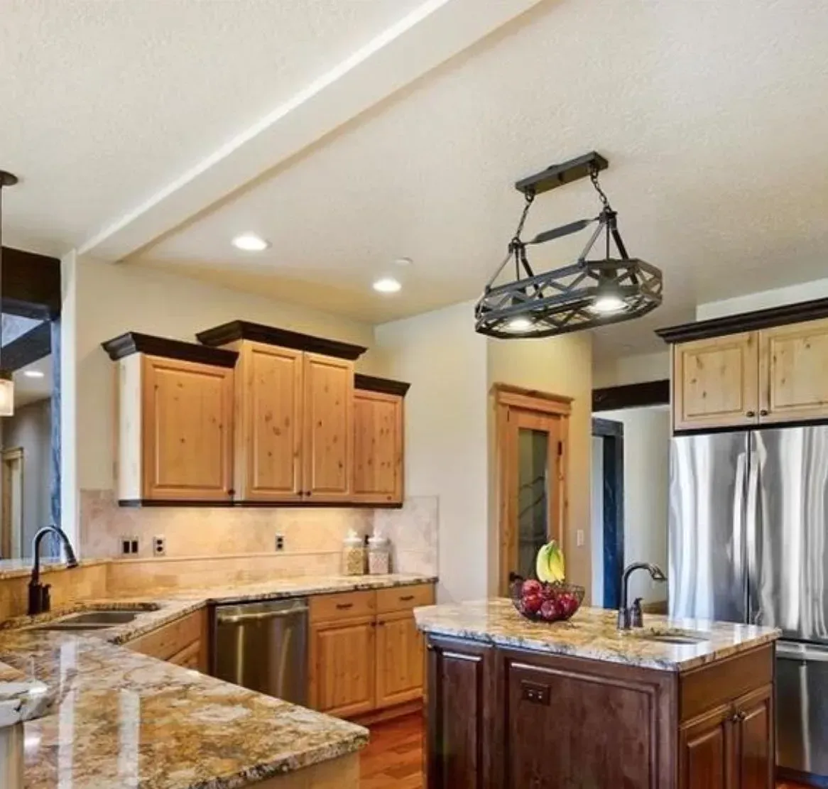 Kitchen with wood cabinets, granite countertops, and stainless steel appliances.
