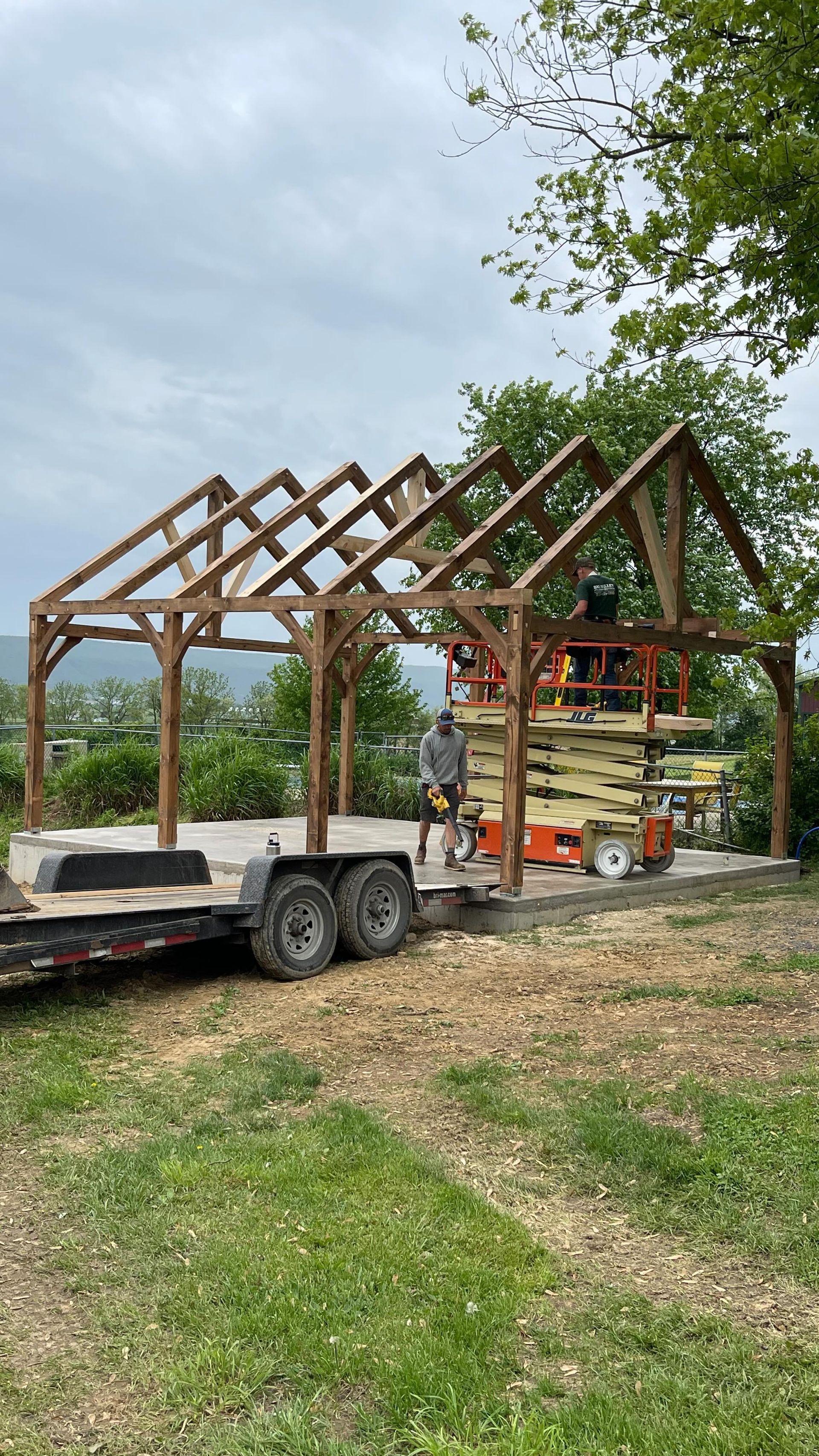 A wooden structure is being built on a trailer.