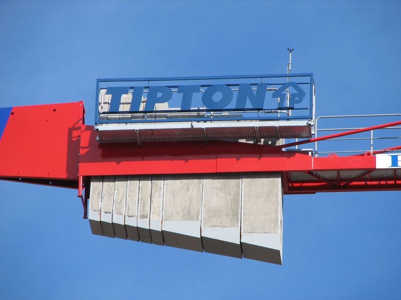 Red and blue construction crane with the name 