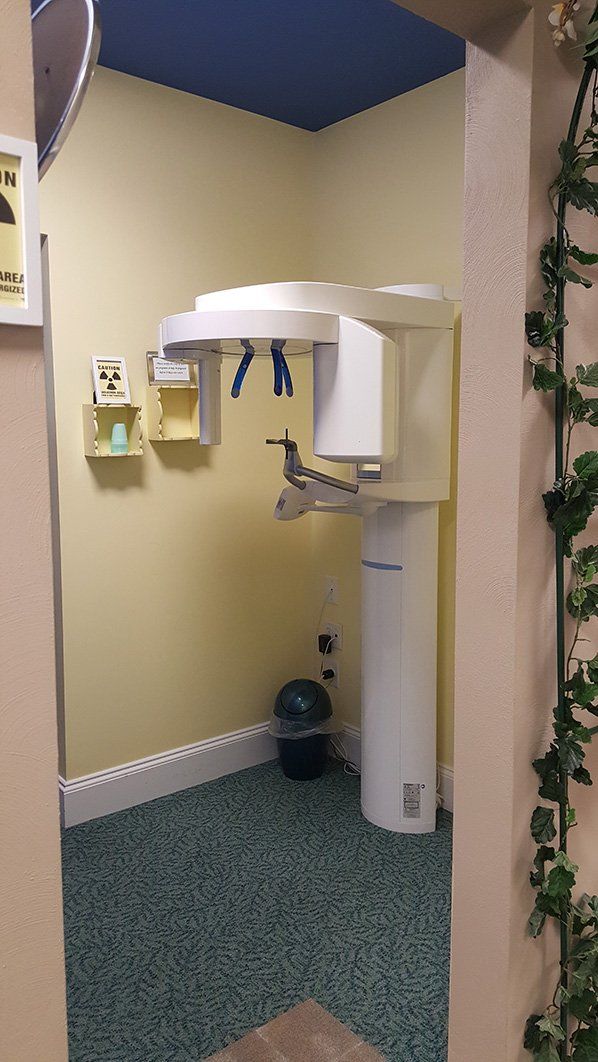 a room with a x-ray machine and a sign that says radiation area