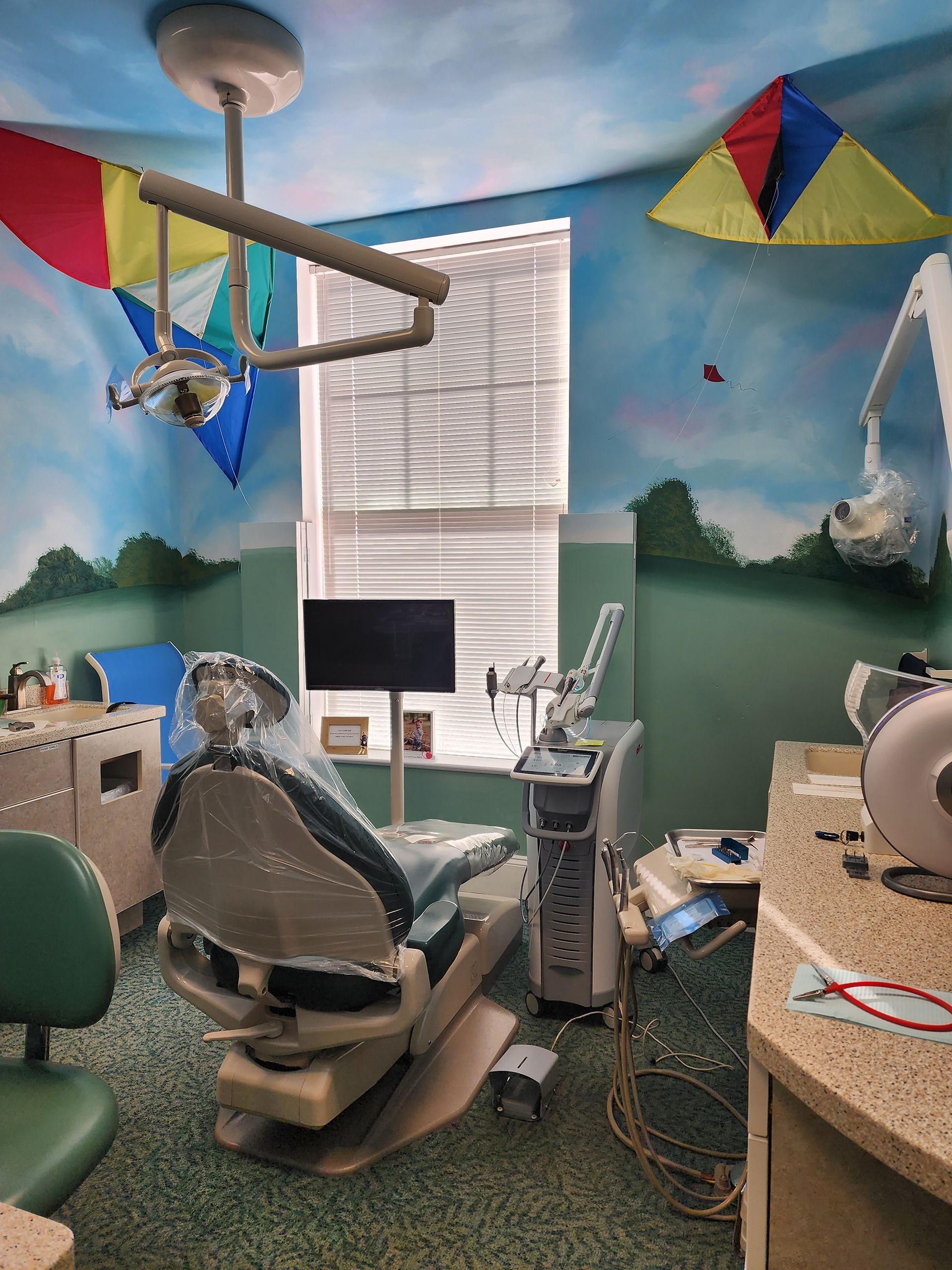 a dental office with a kite hanging from the ceiling