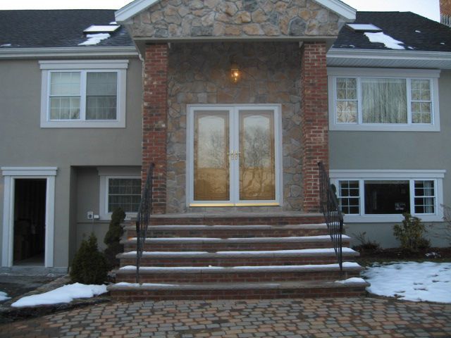 A house with stairs leading up to the front door
