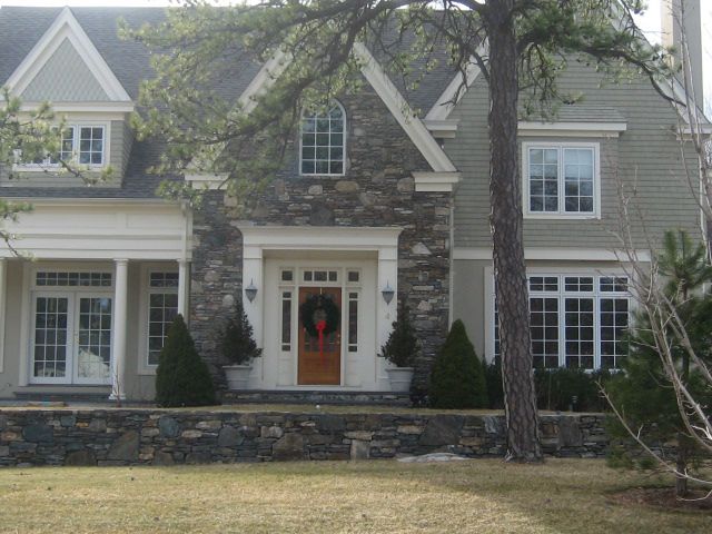 A large house with a wreath on the front door