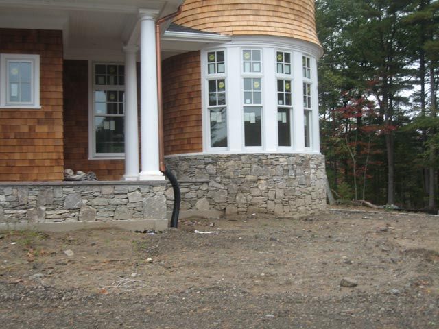 The front of a house with a large bay window