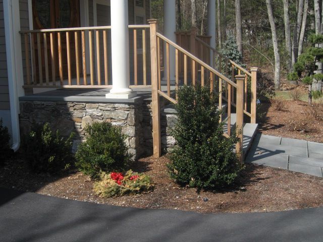 A house with a wooden porch and stairs