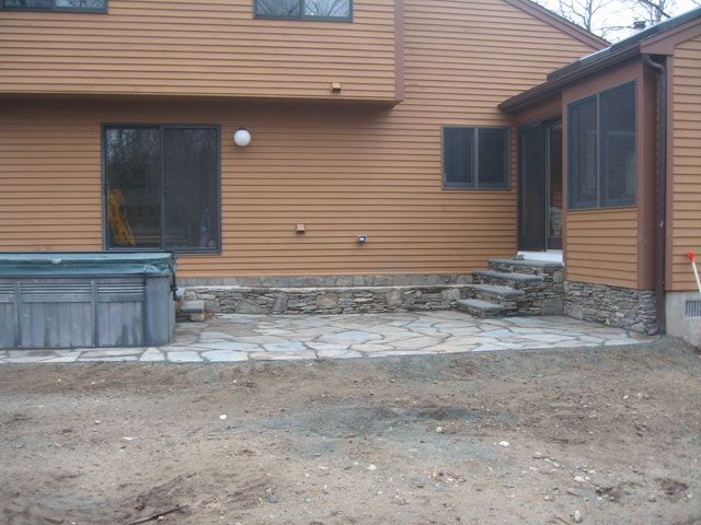 A house with a hot tub in the backyard