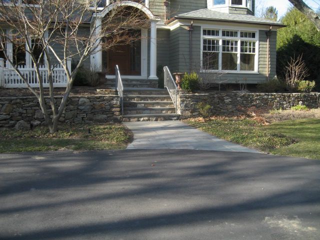 A house with stairs leading up to the front door