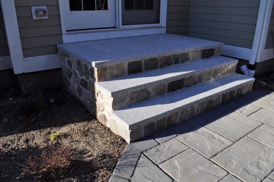 A set of stone steps leading up to a house