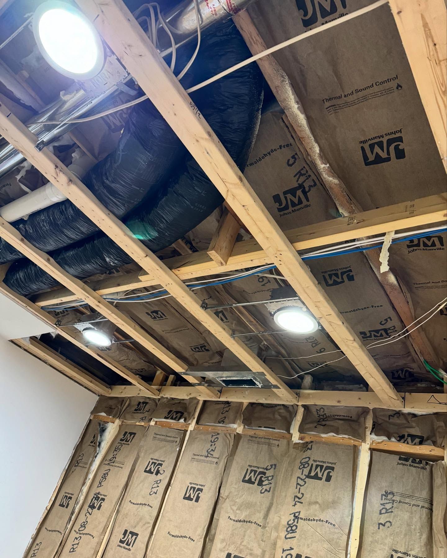 A room with a ceiling that is being built