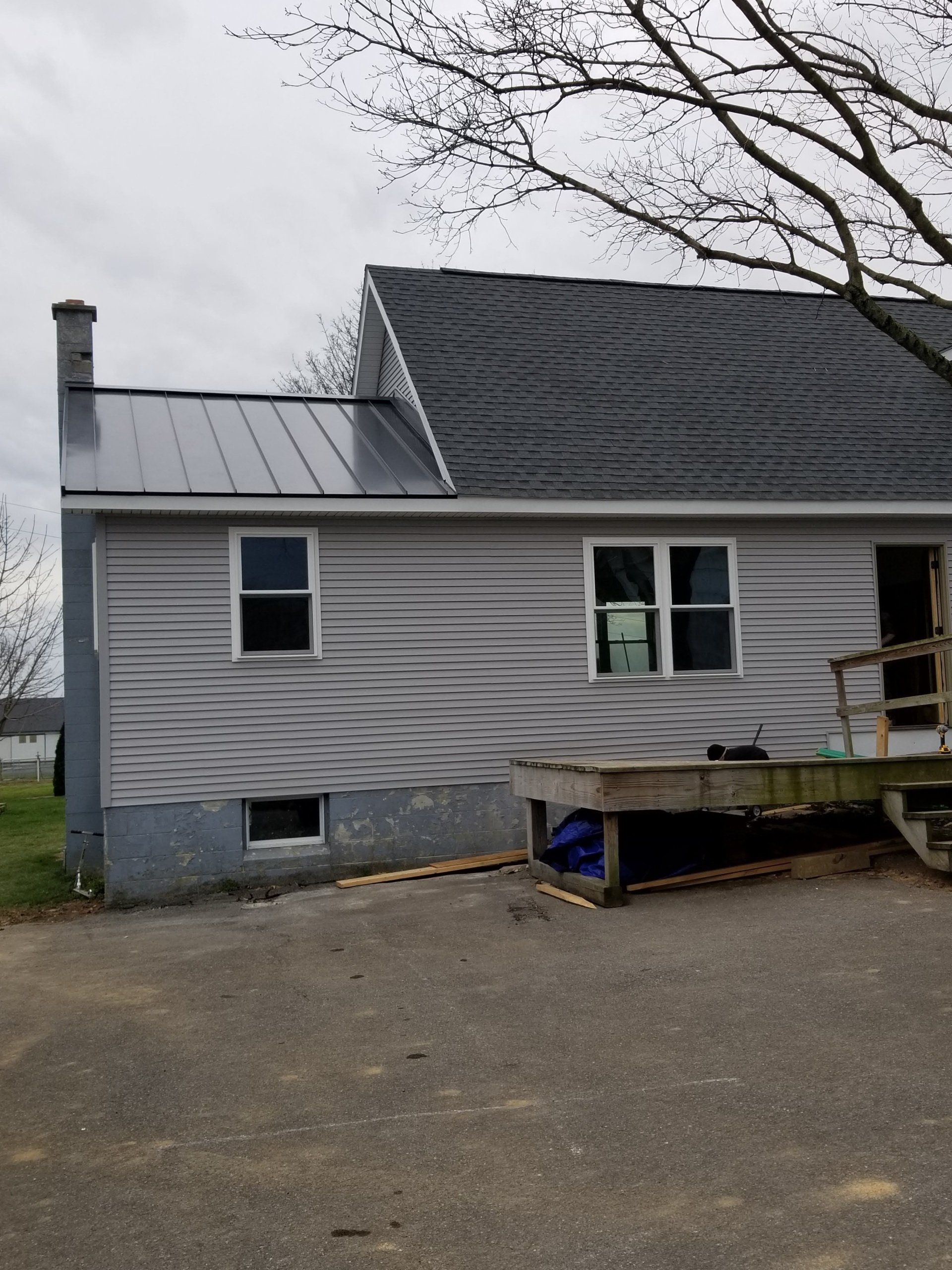 One side of a home with metal roofing