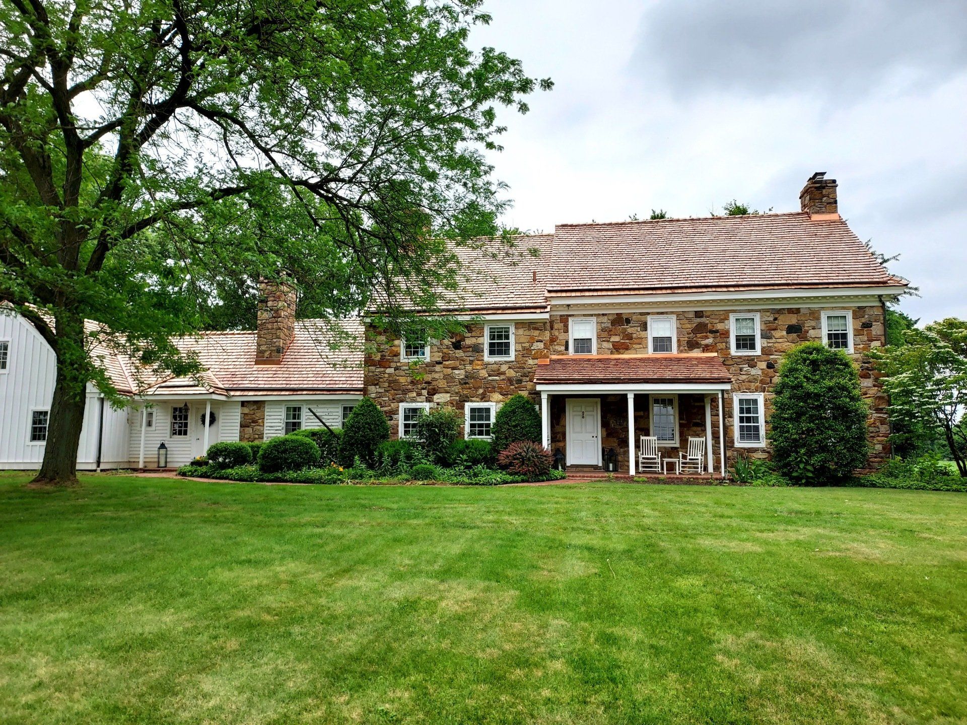 Tile roofing and rock siding