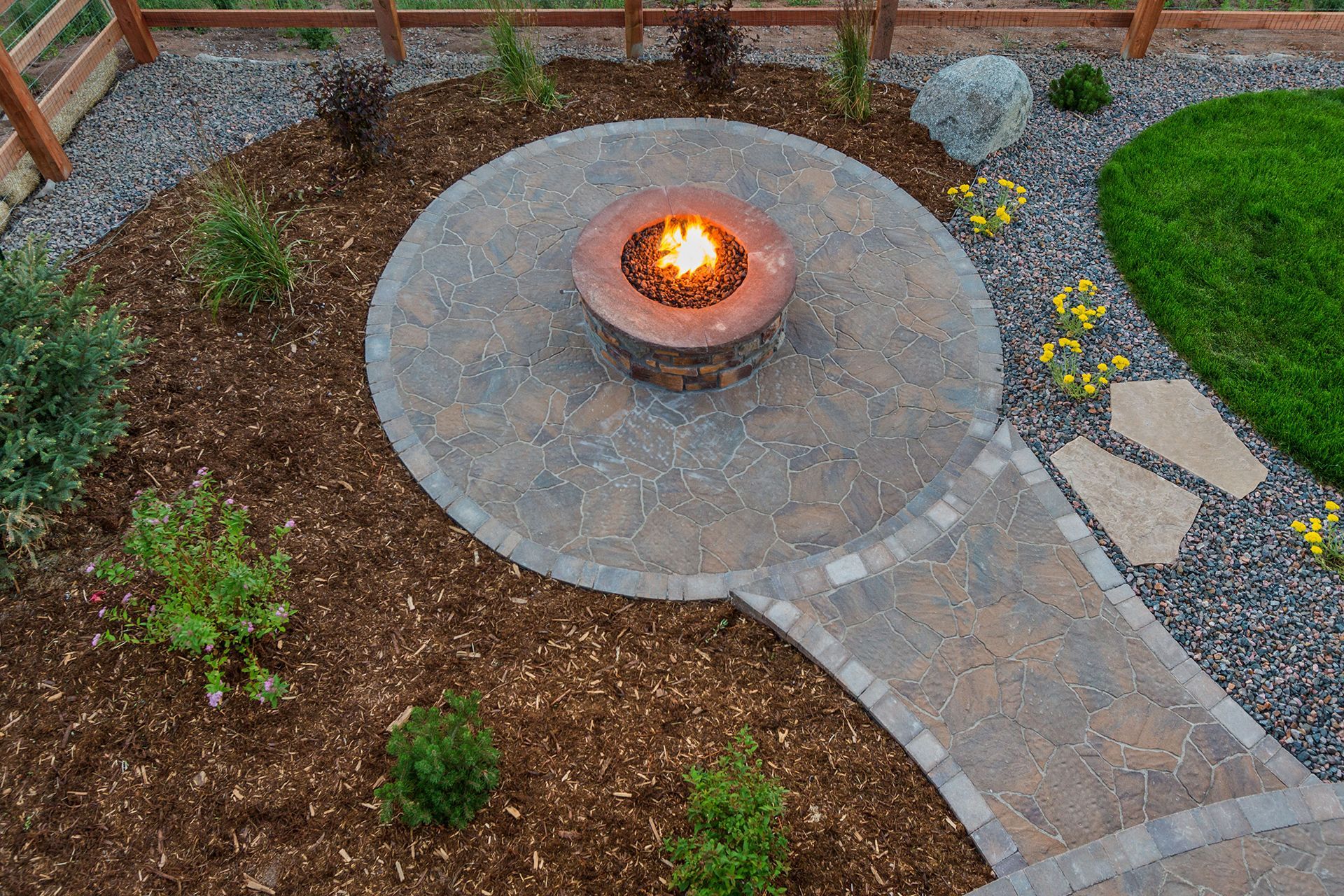 an aerial view of a fire pit in the middle of a garden .
