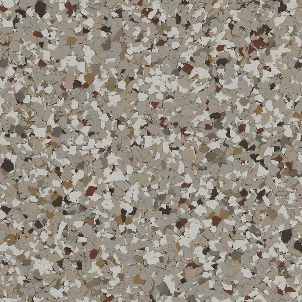 Close-up of a speckled floor in shades of tan, gray, brown, and white.