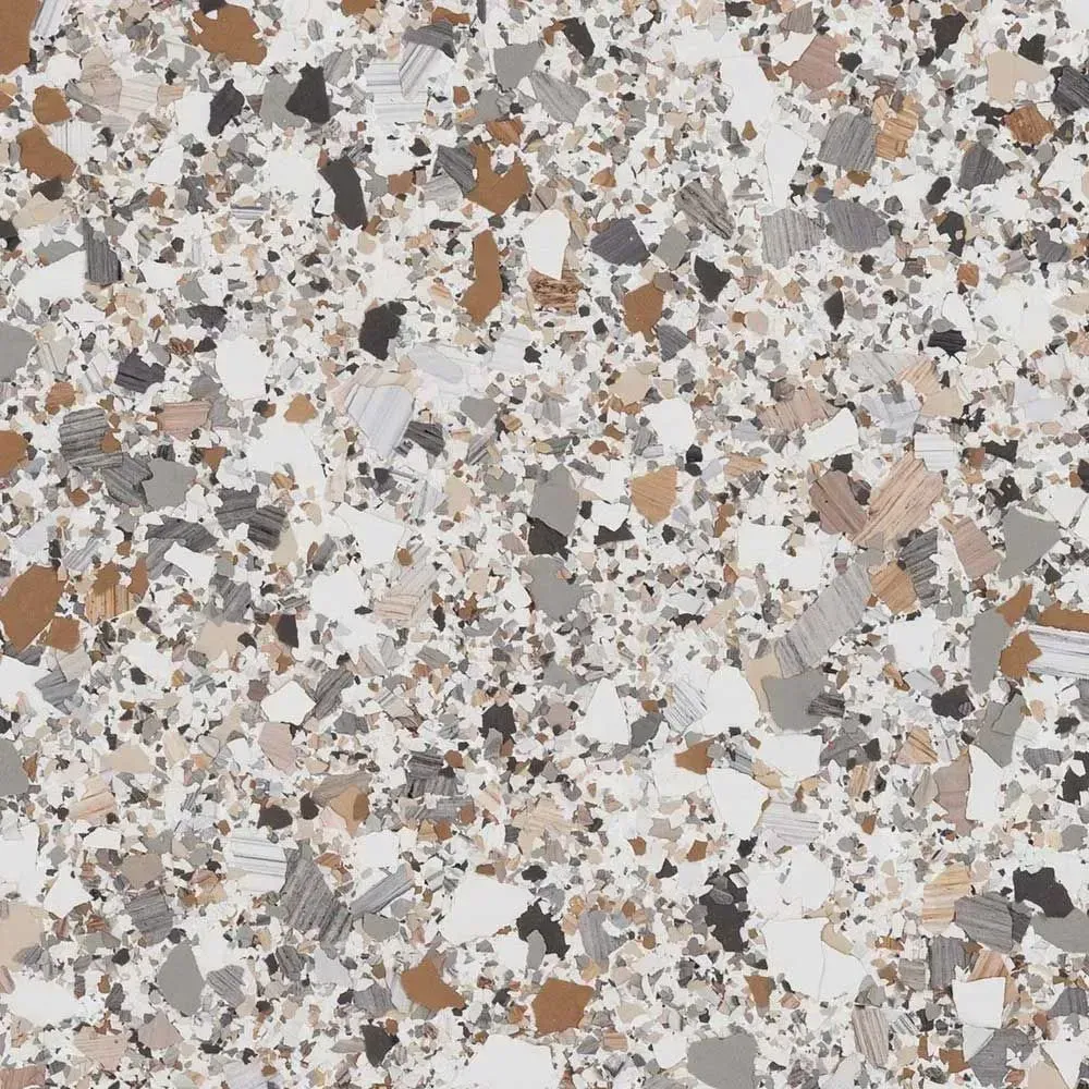 Terrazzo-like floor with small chips of brown, gray, and white against a light background.