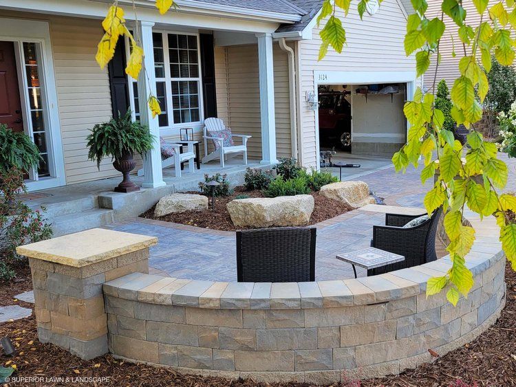 A house with a patio and chairs in front of it
