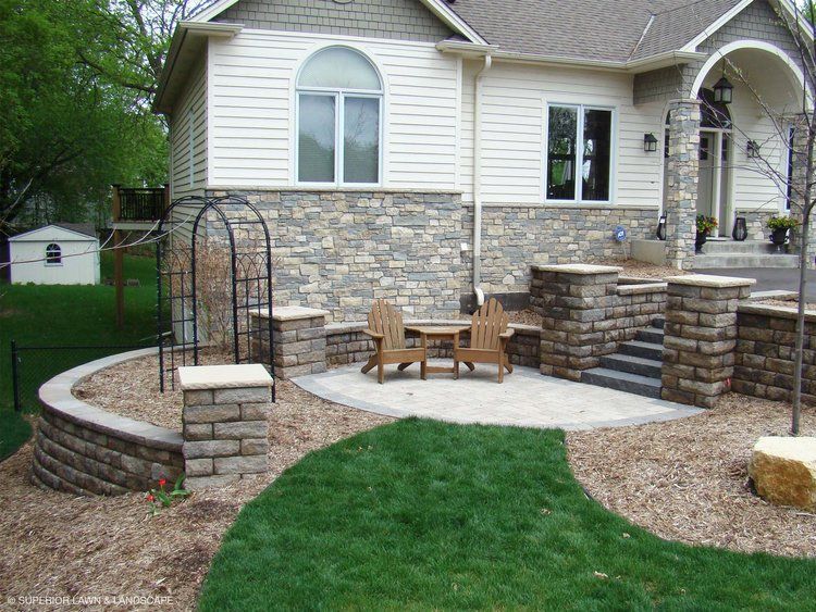 A house with a patio area in front of it