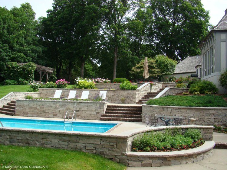 A large swimming pool with stairs leading up to it