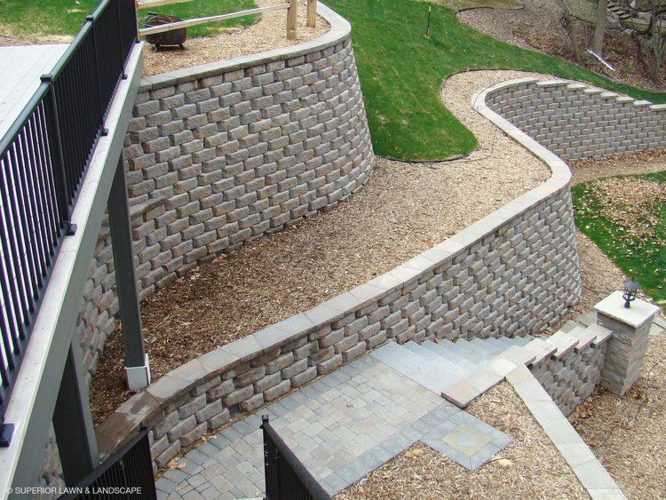 A retaining wall with stairs leading up to it