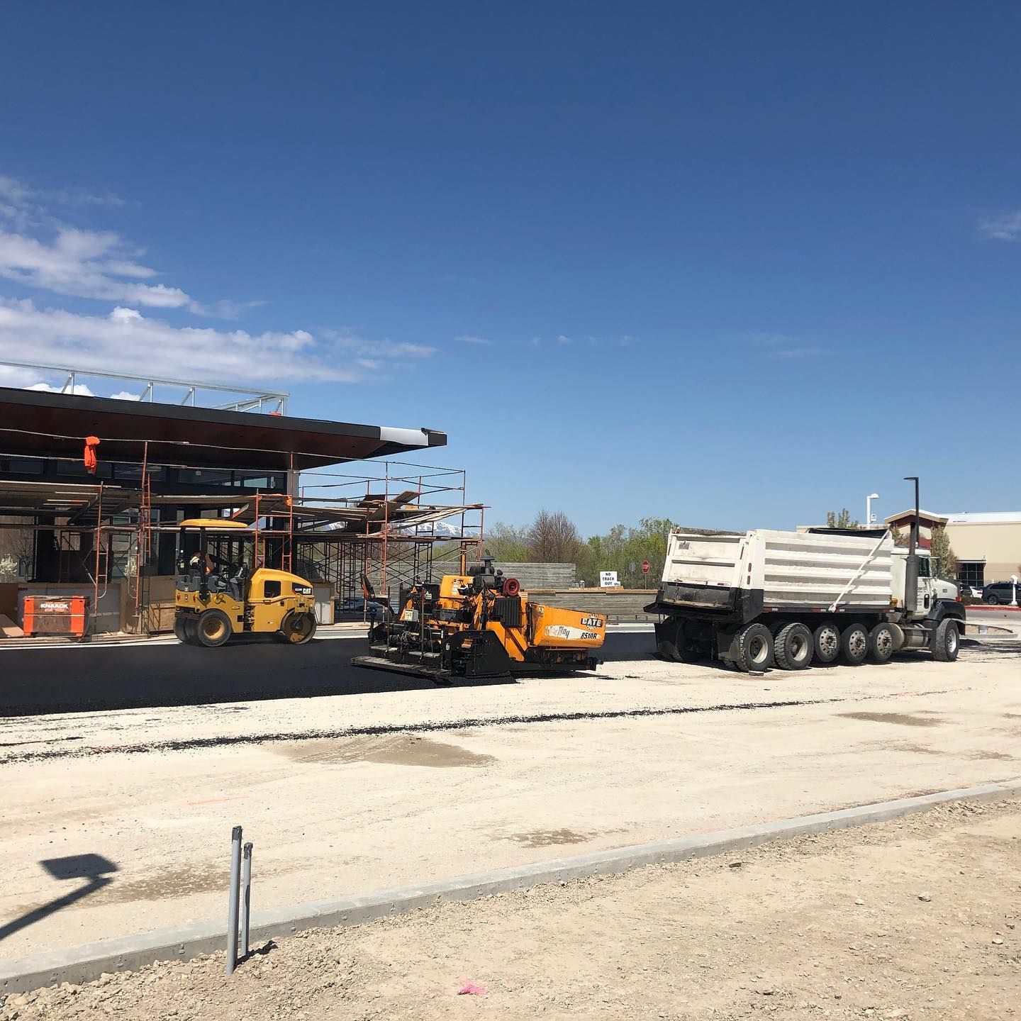 a construction site with a lot of trucks and machinery
