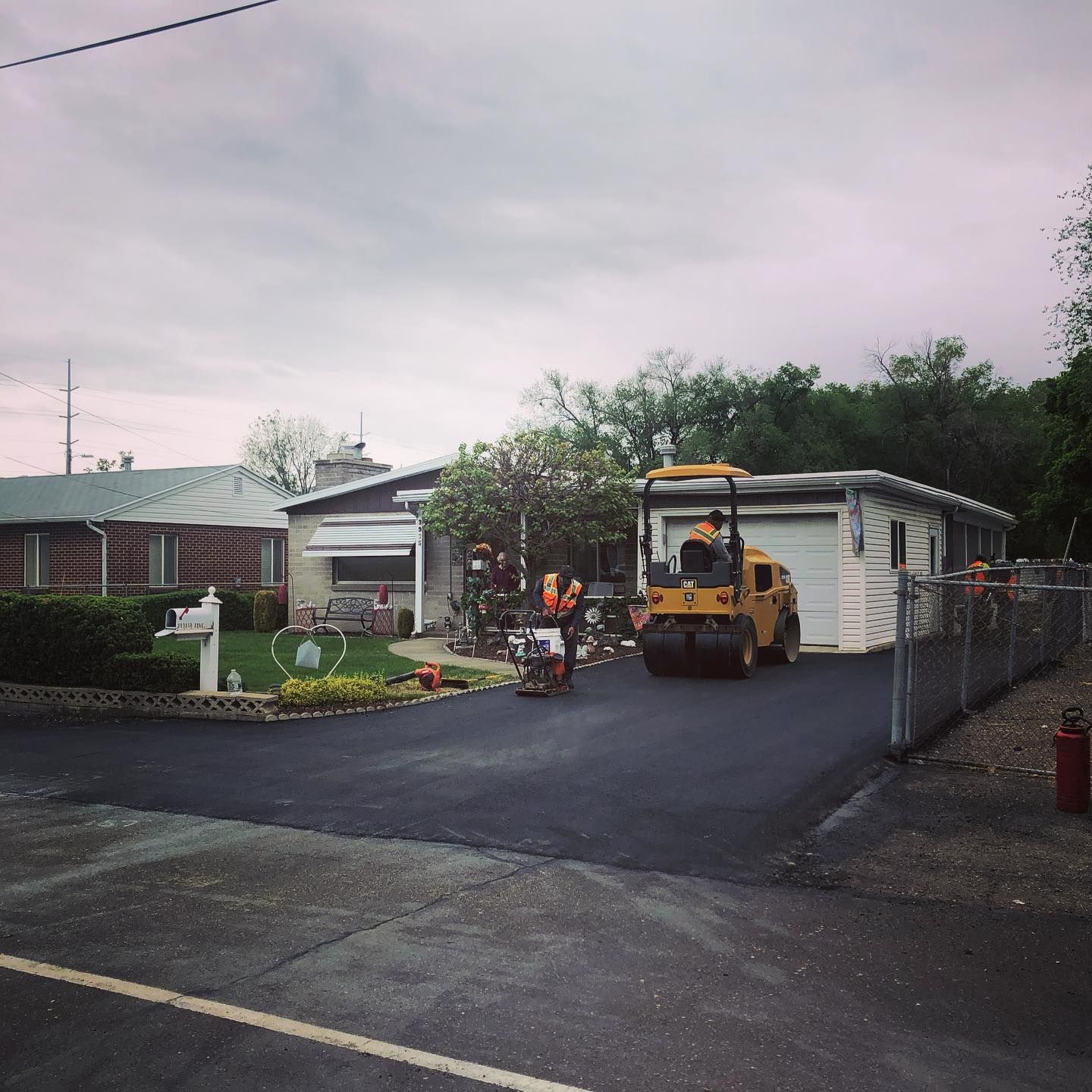 a yellow truck is parked in front of a house