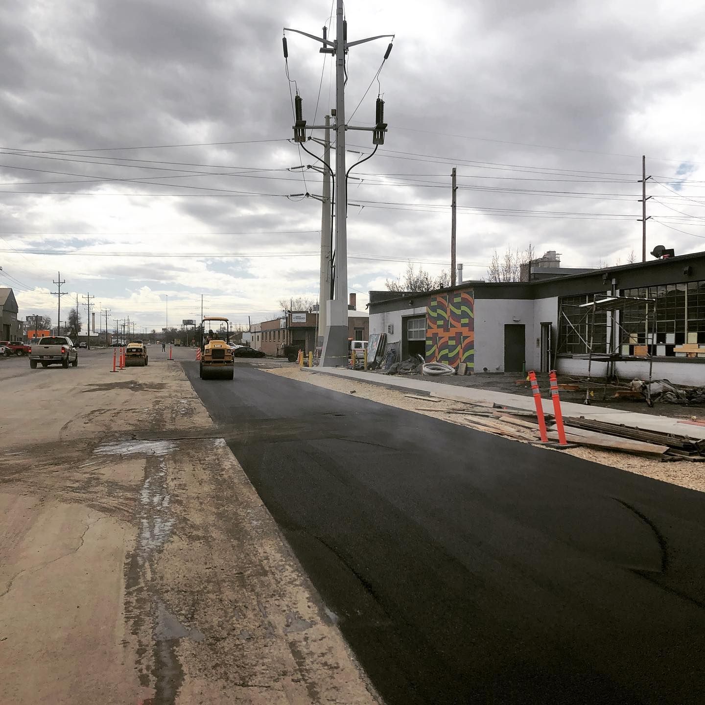 a road that is being paved with a roller