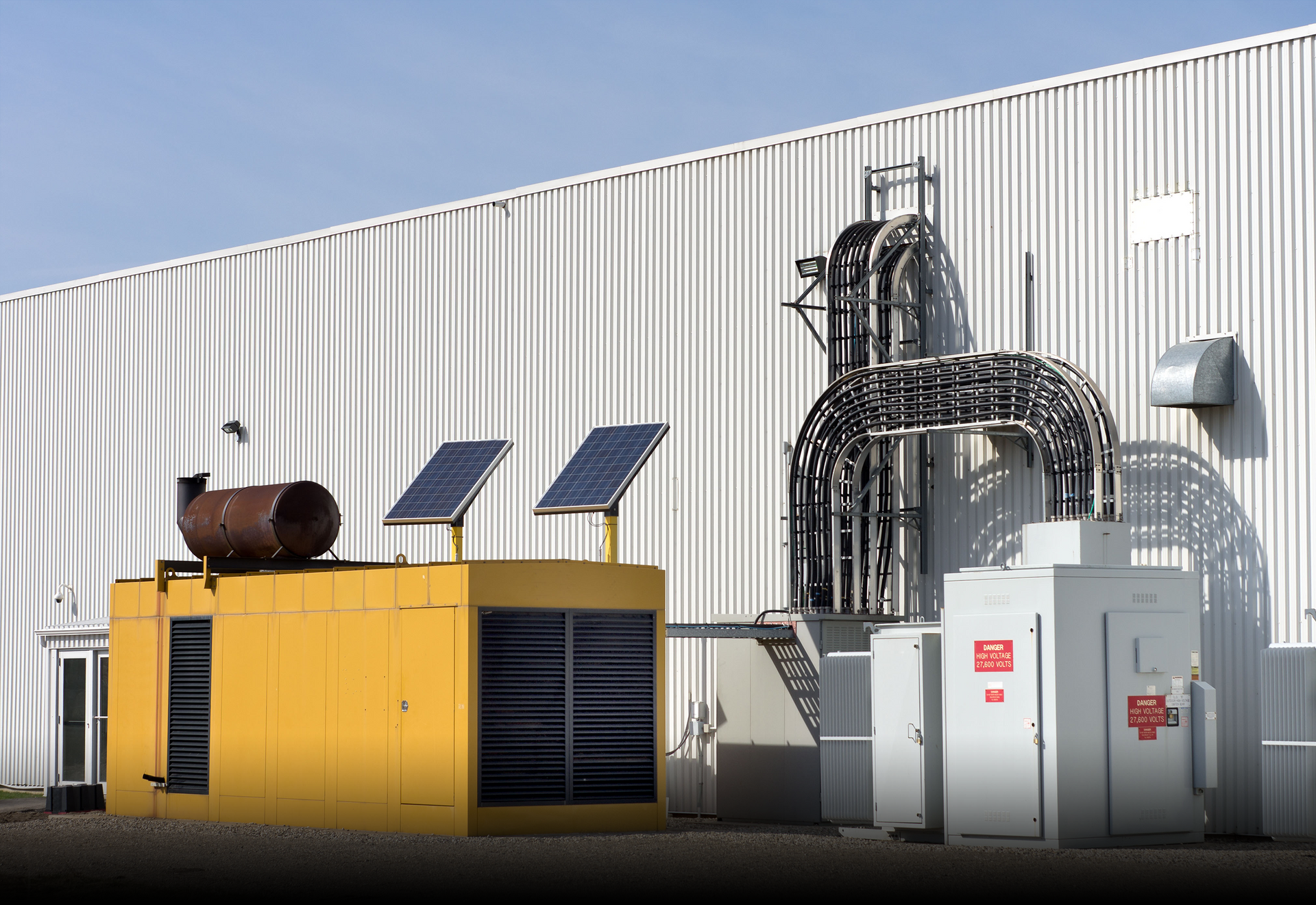 A yellow building with solar panels on top of it