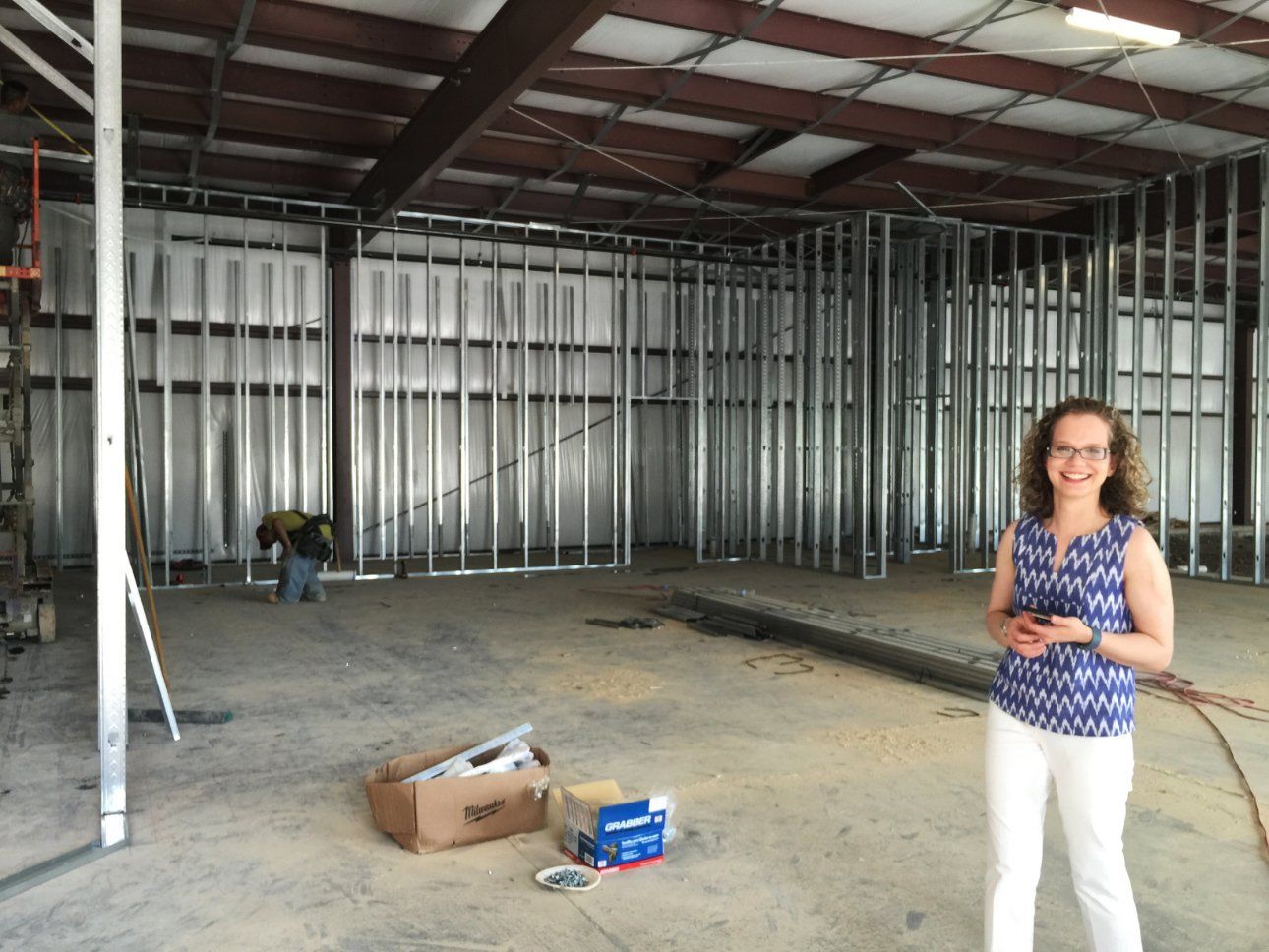 Photo of Brittany at build out of The Pharmacy