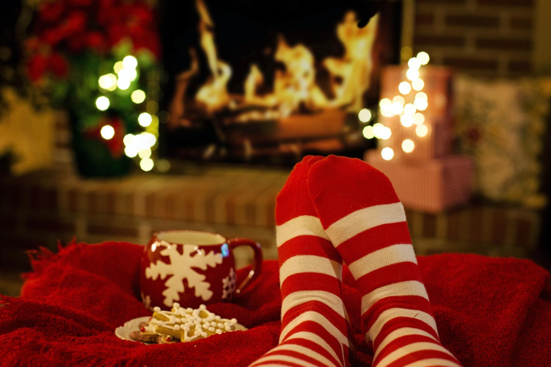 Photo of stockinged feet by fireplace