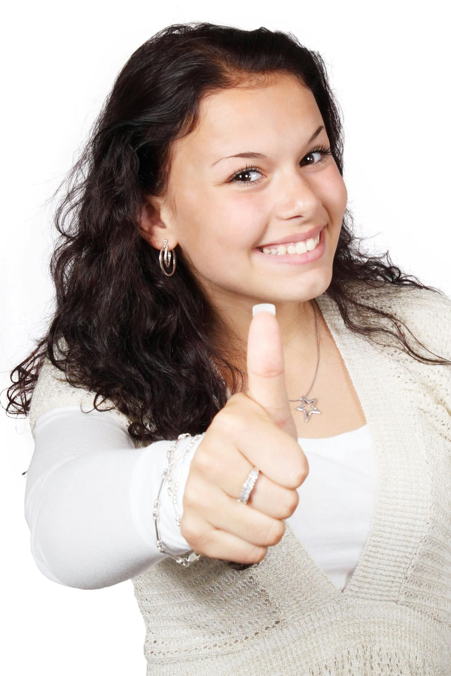 a smiling female showing a thumbs up