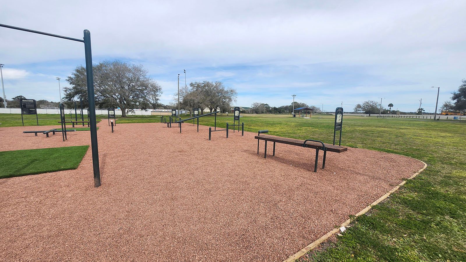 A beautiful park with a lot of exercise equipment in it